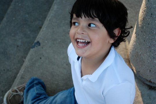 Beautiful Hispanic boy laughing