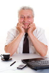 business man sitting by laptop