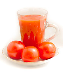 tomato juice and tomato on a saucer three