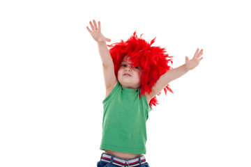 kid wearing a red feather wig
