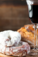 French dried sausage, red wine and loaf of bread