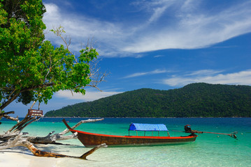 Naklejka na ściany i meble Longtail boat on the beach of Rawi island, Thailand