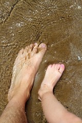 Fototapeta premium father and children feet on summer sand beach
