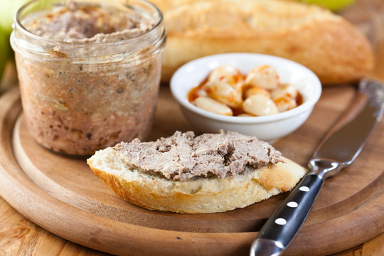 Baguette with pate on kitchen table