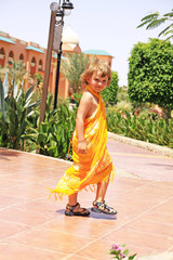 Small girl in yellow pareo