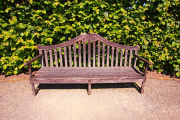 Old, English bench in the garden