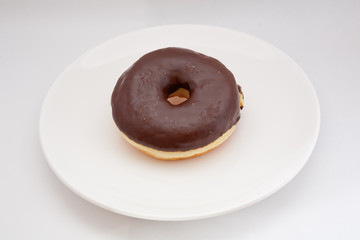 Delicious Chocolate Donut on a dish and white Backgrounds