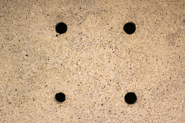 Four holes symmetry