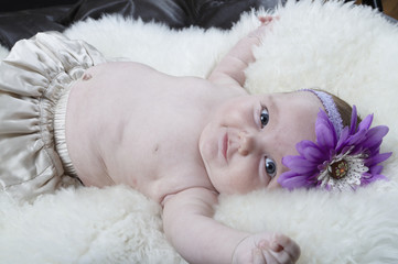 Baby laying on her back