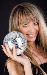 Naklejka premium Smiling blonde holding a sphere
