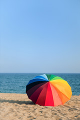Colorful beach parasol © Ivonne Wierink