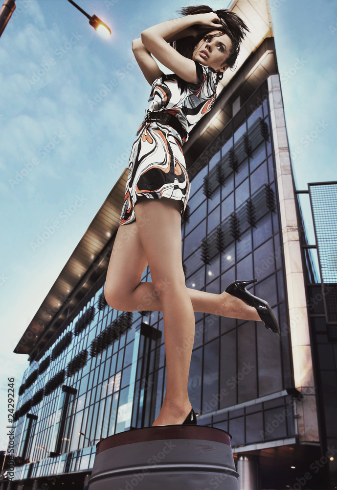 Canvas Prints Cute brunette posing on a city street