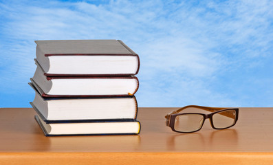 Eyeglasses and books