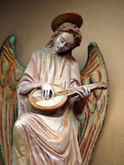 Sculpture of an angel with mandolin. Chiusi , Tuscany,