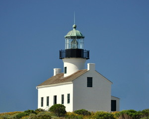 Fototapeta na wymiar Old Lighthouse against a Blue Sky.