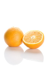 Two perfectly fresh oranges isolated on white.