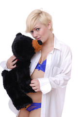 Sexy female cuddling teddy bear