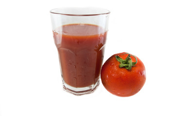 glass of tomato juice and fruit