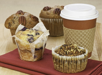 variety of fresh muffins and coffee