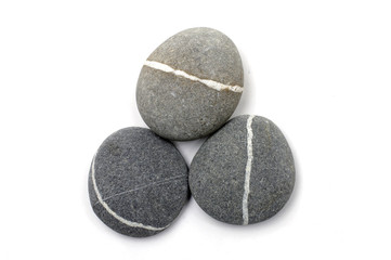 Three stones with white stripes