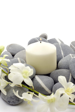 Spa setting- white flowers, pebbles and candle