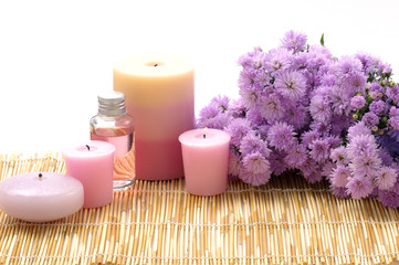 Fototapeta na wymiar Spa set - Chrysanthemums flowers, aroma candles,