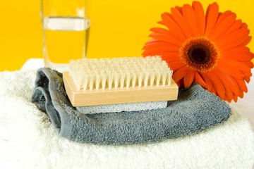 A SPA set with towels and a red gerber