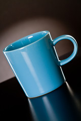 Blue cup on a grey gradient background