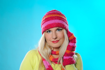 Seasonal portrait of pretty funny woman in hat and gloves smilin