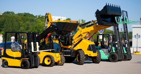 Small yellow and blue tractors