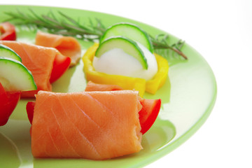 smoked salmon slices on green