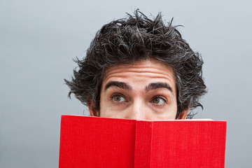 Young man reading a book