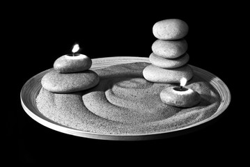 Stones and birning candles on sand. Black&White