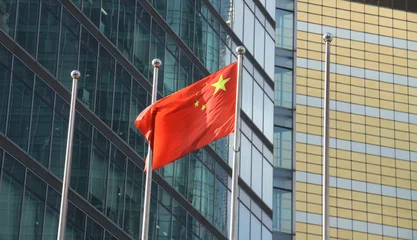 Fotobehang chinese flag at a business area © gringos