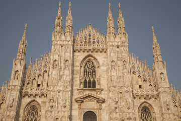 Top part of main facade of Duomo Cathedral Church in Milan