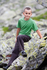 Naklejka na ściany i meble Cute kid outdoor in mountains