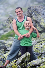 Father and son in mountains