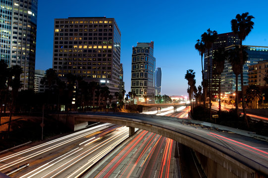 Los Angeles skyline and freeway at twilight