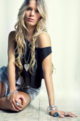 long hair blond female fashion model posing jewelry clothes
