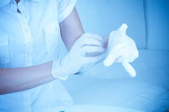 Pulling On Surgical Glove