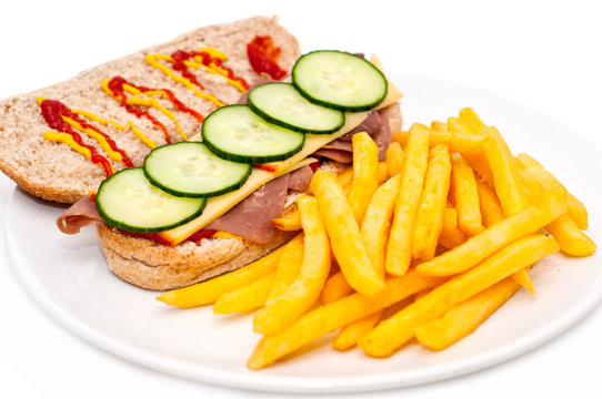 freshly made beef sandwich with french fries isolated