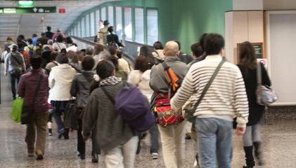 passengers leaving the airport arrival area