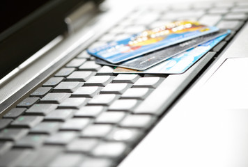 Credit cards and laptop. Shallow DOF