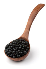 currant in a wooden spoon