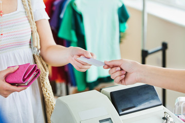 Close-up of a caucasian woman paying with her credit card