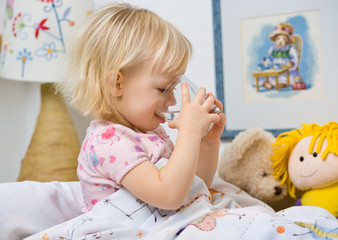 little girl in bed drinking water © mbt_studio
