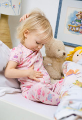 little girl in bed witch stomackache © mbt_studio