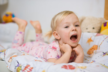 little girl in bed