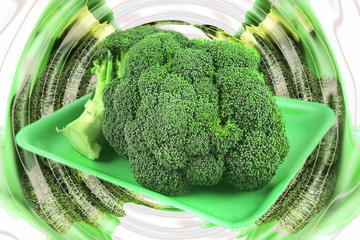 fresh raw broccoli on plastic plate