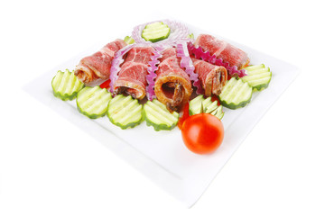 served meat rolls on white